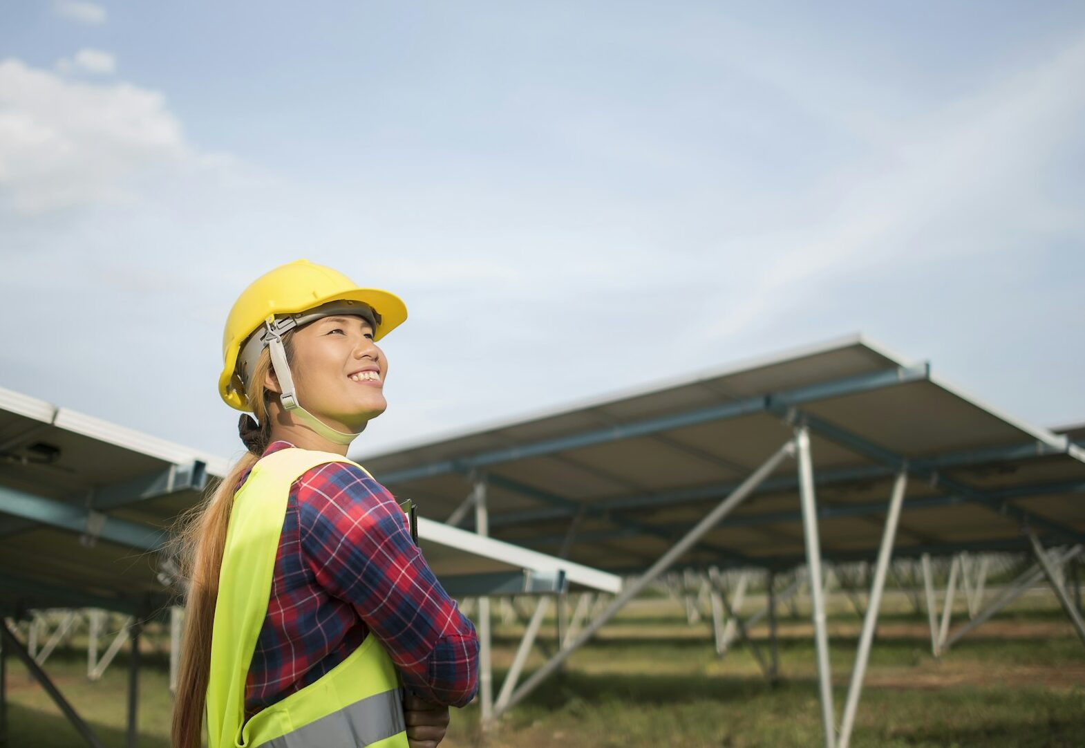 Engineer electric woman checking and maintenance of solar cells.